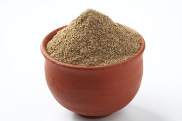 Indian spices Black Pepper powder in a terracotta bowl  