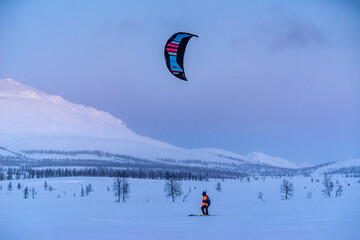 kiting in the winter mountains in russia