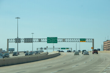HOUSTON, TEXAS - March, 2022:  Traffic signs and signals all over the freeway road