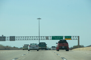 HOUSTON, TEXAS - March, 2022:  Traffic signs and signals all over the freeway road