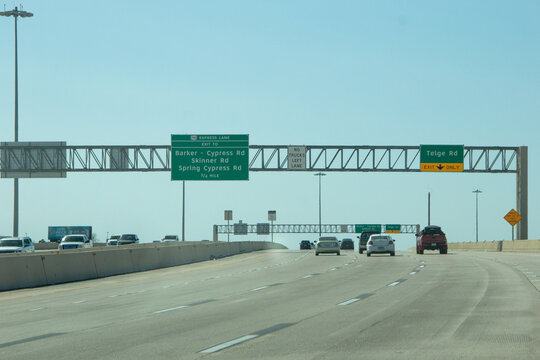 HOUSTON, TEXAS - March, 2022:  Traffic signs and signals all over the freeway road