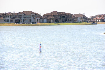 Lake houses and boats around a lake