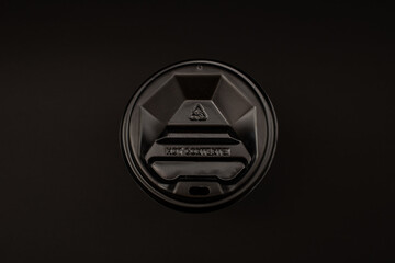 Disposable coffee cup with plastic lid