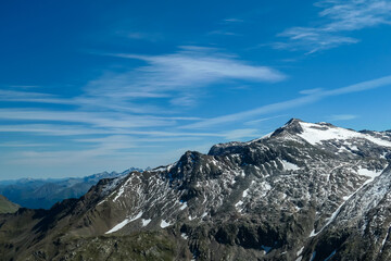 Panoramic view on the summit of Schareck in the High Tauern Alps in Carinthia and Salzburg, Austria, Europe. Mountain ranges in the Hohe Tauern National Park. High altitude landscape. Nature