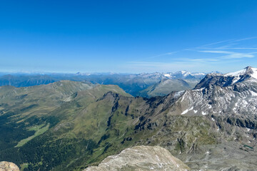 Fototapeta premium Panoramic view on the summit of Schareck in the High Tauern Alps in Carinthia and Salzburg, Austria, Europe. Mountain ranges in the Hohe Tauern National Park. High altitude landscape. Nature