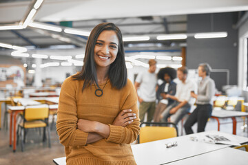 I have full confidence in my team and their ability. Cropped portrait of an attractive young businesswoman in the office with his colleagues in the background.