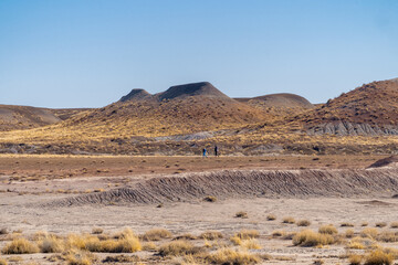 hikers in desert riverbed