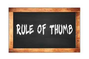 Fototapeta premium RULE OF THUMB text written on wooden frame school blackboard.