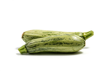 Fresh cut zucchini isolated on a white background with clipping path. Design element for product label. Design image of fresh whole zucchini. Green zucchini vegetables isolated on white.