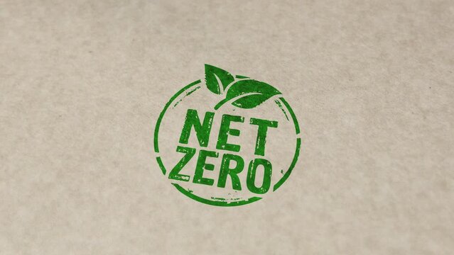 Net zero and eco friendly symbol stamp and hand stamping impact animation. Co2 neutral, ecology, environment, carbon emissions reduction and green energy 3D rendered concept.