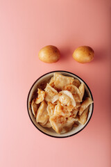 dumplings in a plate on a pink background