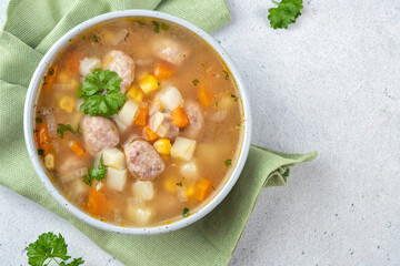 Chicken meatball soup with potato, carrot and corn