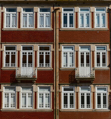 PORTO, PORTUGAL- APRIL 4, 2022: Traditional historic facade decorated with colorful tiles