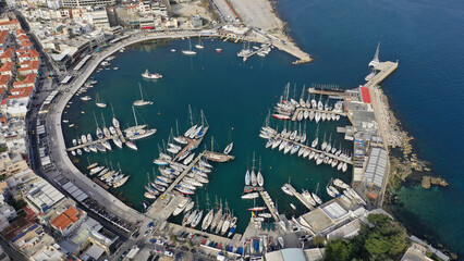 Aerial drone photo of iconic round shaped picturesque port of Mikrolimano with anchored sail boats and yachts after renovation, Piraeus, Attica, Greece