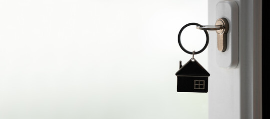 silhouette of house key in the door lock