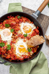 Shakshouka, eggs poached in sauce of tomatoes, peppers and onion. Keto meal, low carb.