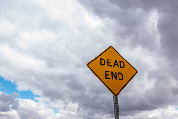 dead end sign in the clouds