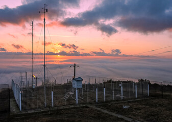 Mahmudia weather station at sunrise with sea of clouds