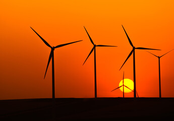 wind turbines in the sunset