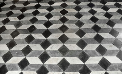 floor made with many pieces of marble that form parallelepipeds with 3D effect