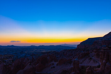 Fototapeta na wymiar Cappadocia at dusk. Beautiful sunset view in Cappadocia