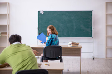 Two students having fun in the classroom