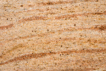 Granite texture, granite slab background, yellow marble stone. Decorative element of old building fasade. Empty space for text