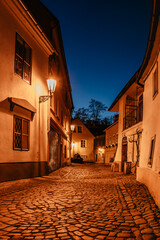 Fototapeta na wymiar Quarter called New World in Prague consists of winding streets and small picturesque houses dating back to Middle Ages.Charming place with romantic atmosphere.Evening city,illuminated buildings