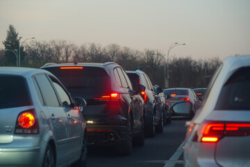 traffic. cars caught in the crowd. photo taken in the evening. people in traffic returning from work