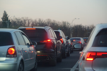 traffic. cars caught in the crowd. photo taken in the evening. people in traffic returning from work