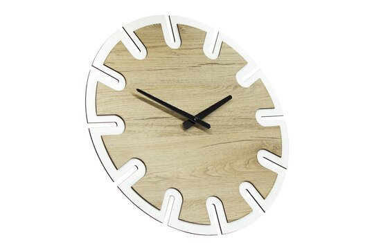 Close-up of a wooden wall clock on a white background. A white wall clock hangs on the wall. Minimalist flat image of wall clock isolated on background. Copy space and center composition.