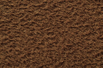 Closeup brown suede texture background.