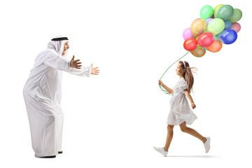 Full length profile shot of a girl with balloons running towards an arab man