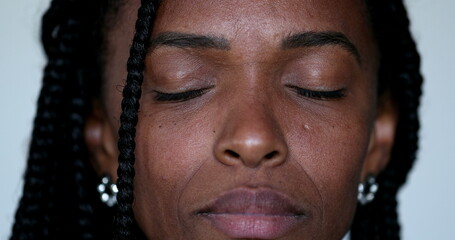 African black woman eyes closed in contemplation and meditation