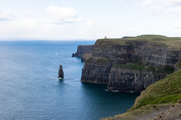 Irish cliffs on a sunny day. Cliffs of Moher tourist attraction in Ireland.