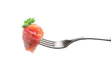 Salmon piece on fork isolated on white background