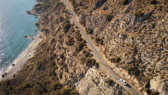 Aerial view of road along the beautiful blue coast, road trip