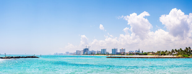 panoramic view Pompano Beach, Florida with city and ocean. empty space in sky with clouds 
