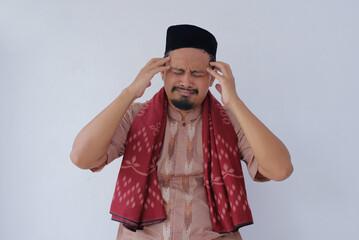 asian muslim man with headache