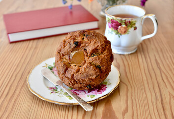 Simple tasty tea and muffin for breakfast or afternoon relaxing snack to enjoy with a good book.