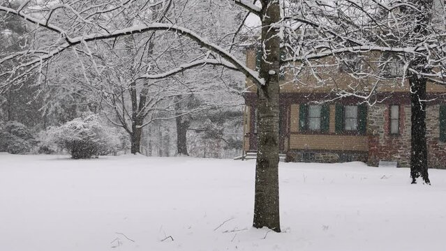 Winter snow falling slowly on historic Huguenot Street in New Paltz, New York