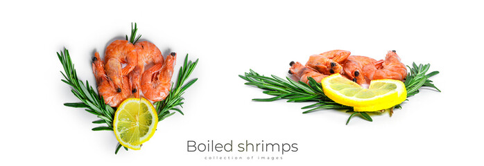 Boiled shrimps with lemon and rosemary on a black plate isolated on a white background.