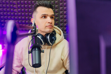 pensive professional radio host broadcasts live reads news 