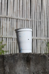 used plastic cups on concrete