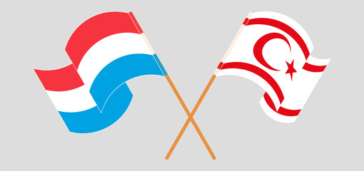 Crossed and waving flags of Luxembourg and Northern Cyprus