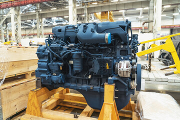 Diesel engine motor of tractor or combine harvester in industrial factory close up.