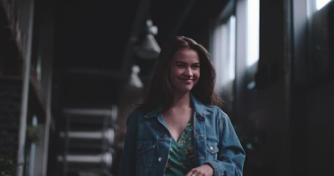 Young woman arriving at the reserved table for dinner