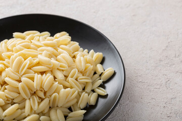 Freshly cooked gnocchi pasta close-up in a frying pan. Italian cooking