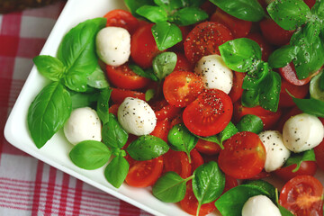 Caprese salad with mini mozzarella and cherry tomatoes. Italian Cuisine. Healthy food.
