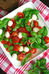 Caprese salad with mini mozzarella and cherry tomatoes. Italian Cuisine. Healthy food.